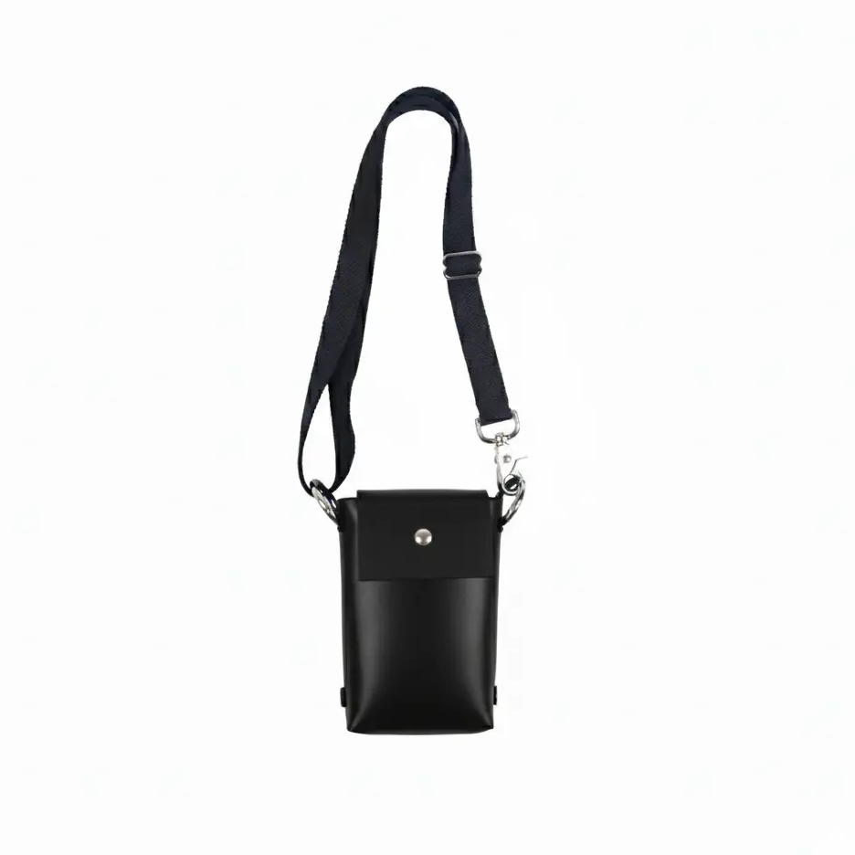 Black crossbody bag with a strap on a white background