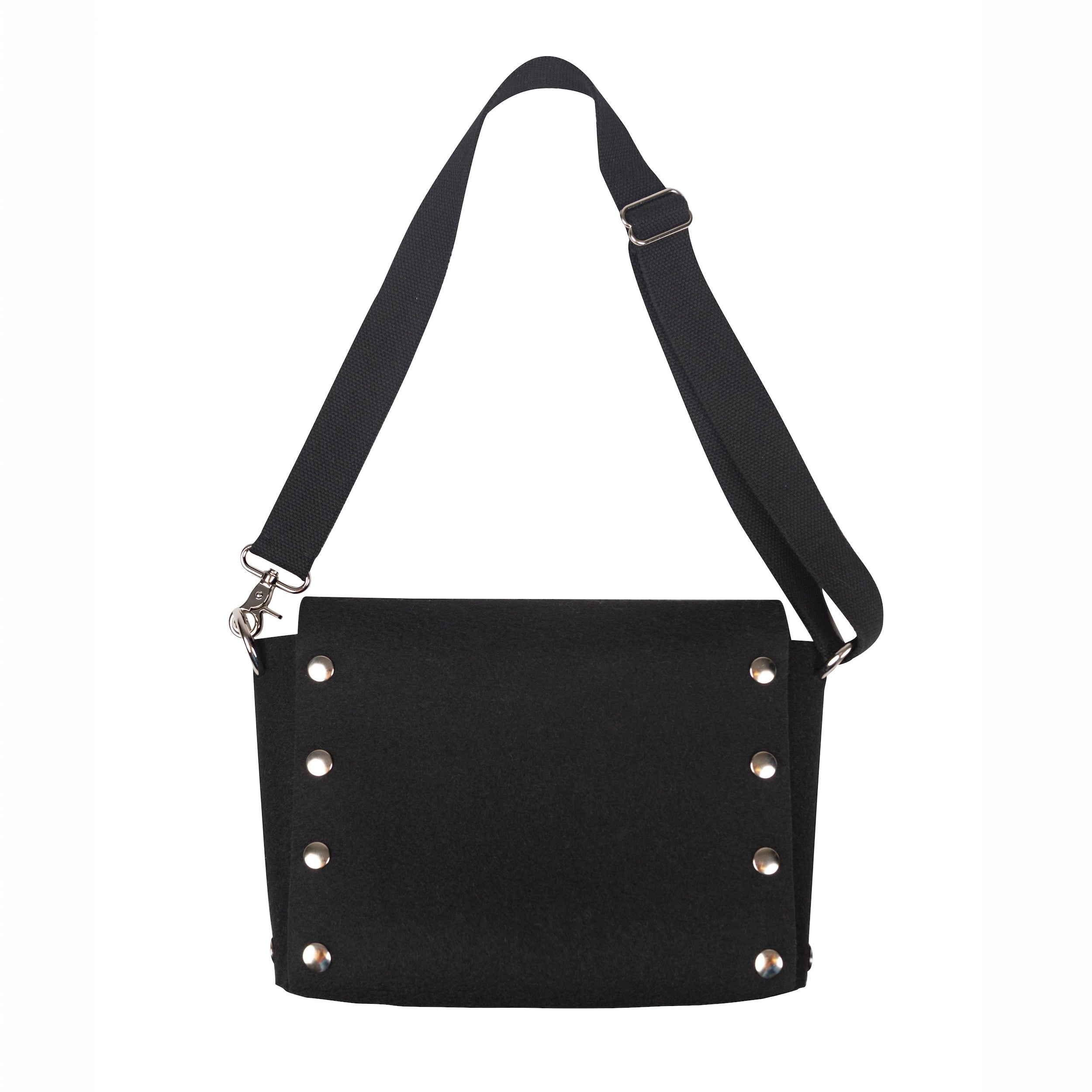 Black crossbody bag with studded details on a white background