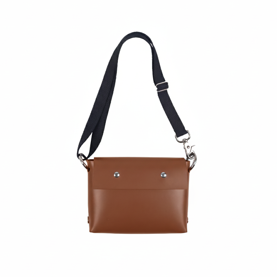 Brown leather crossbody bag with a black strap on a white background