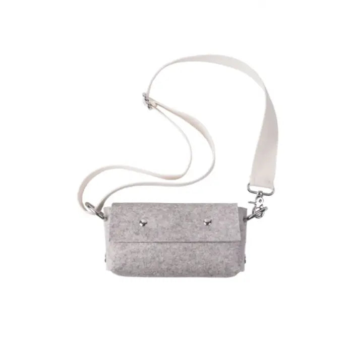 Gray crossbody bag with a strap on a white background
