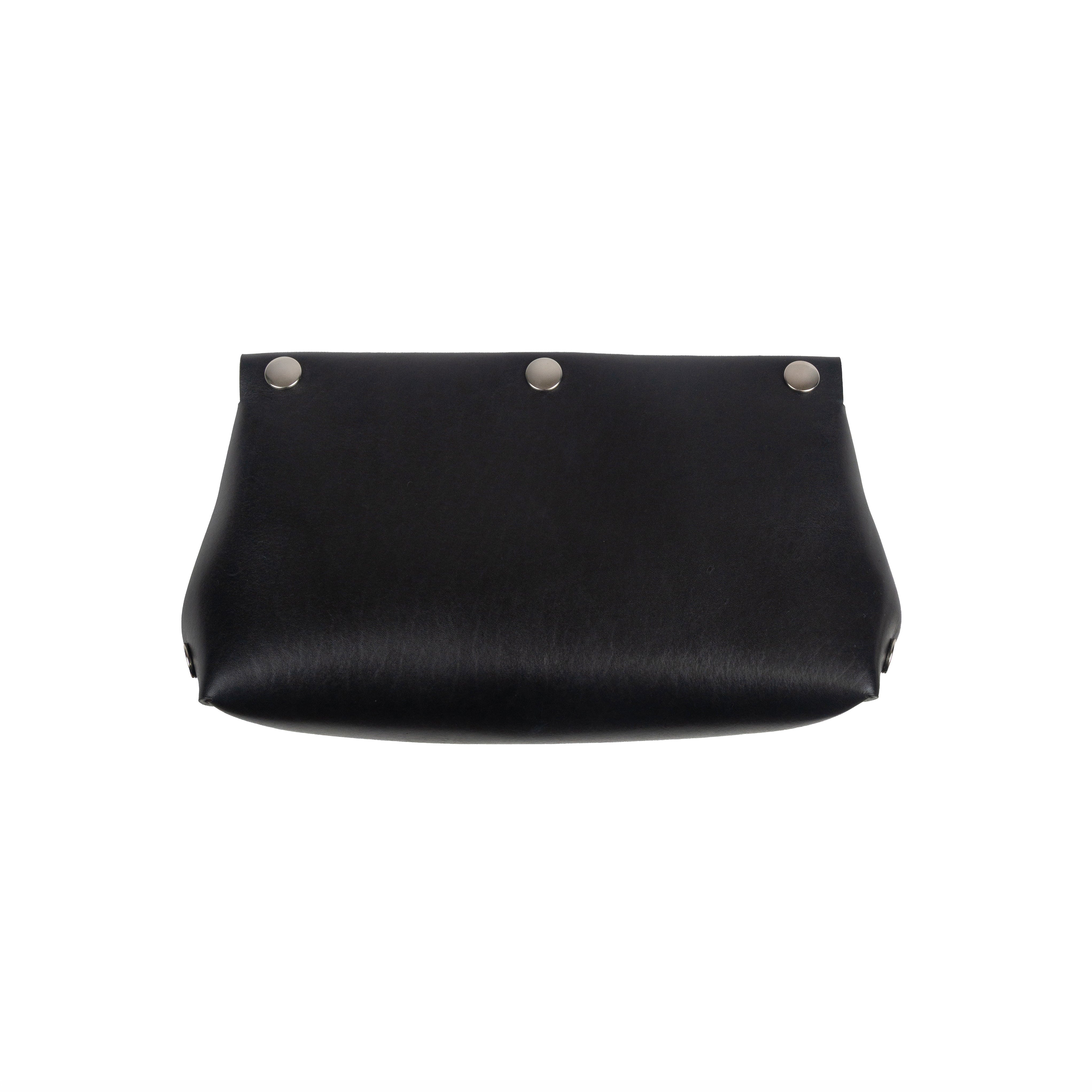 Black clutch bag with silver buttons on a white background