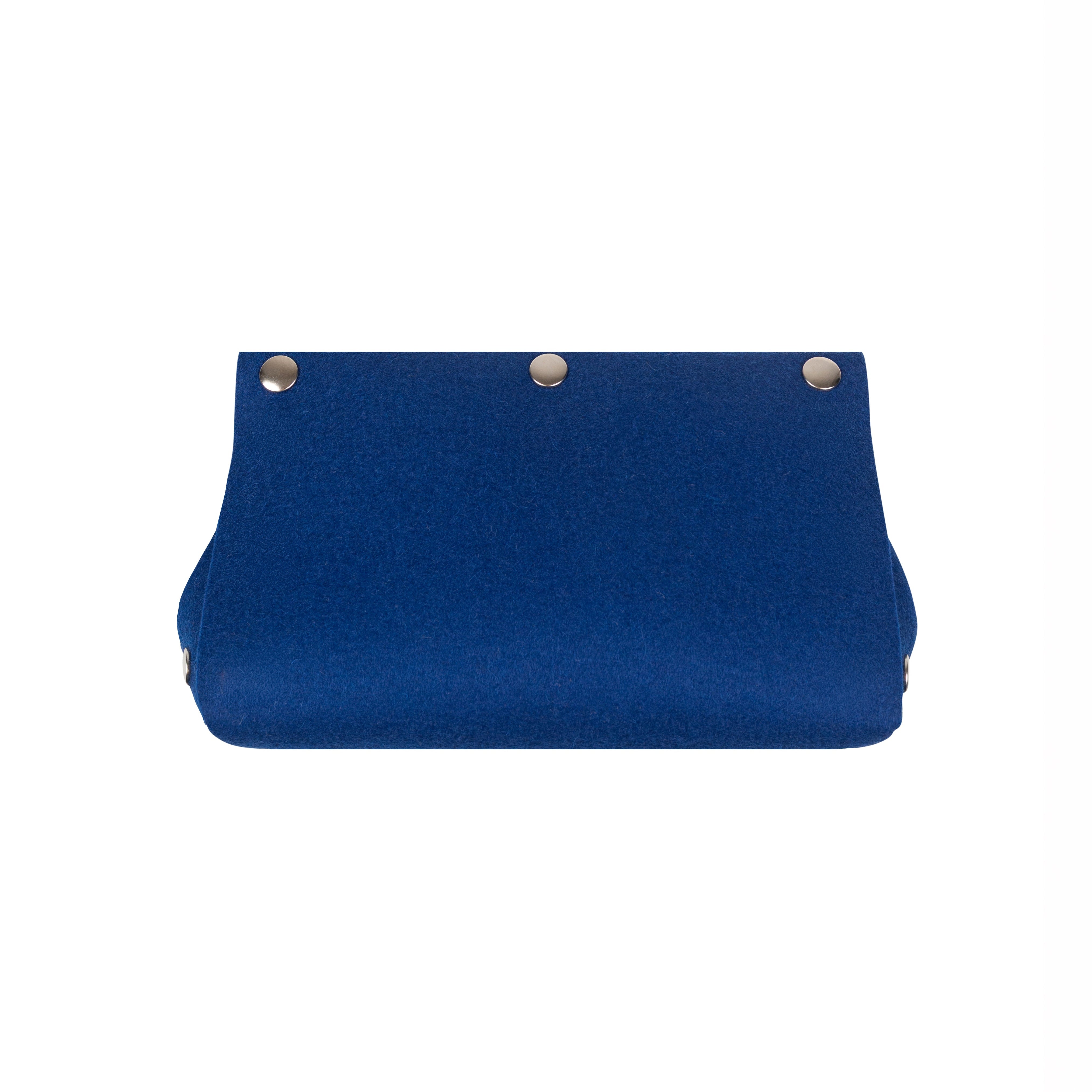 Blue clutch bag with gold hardware on a white background