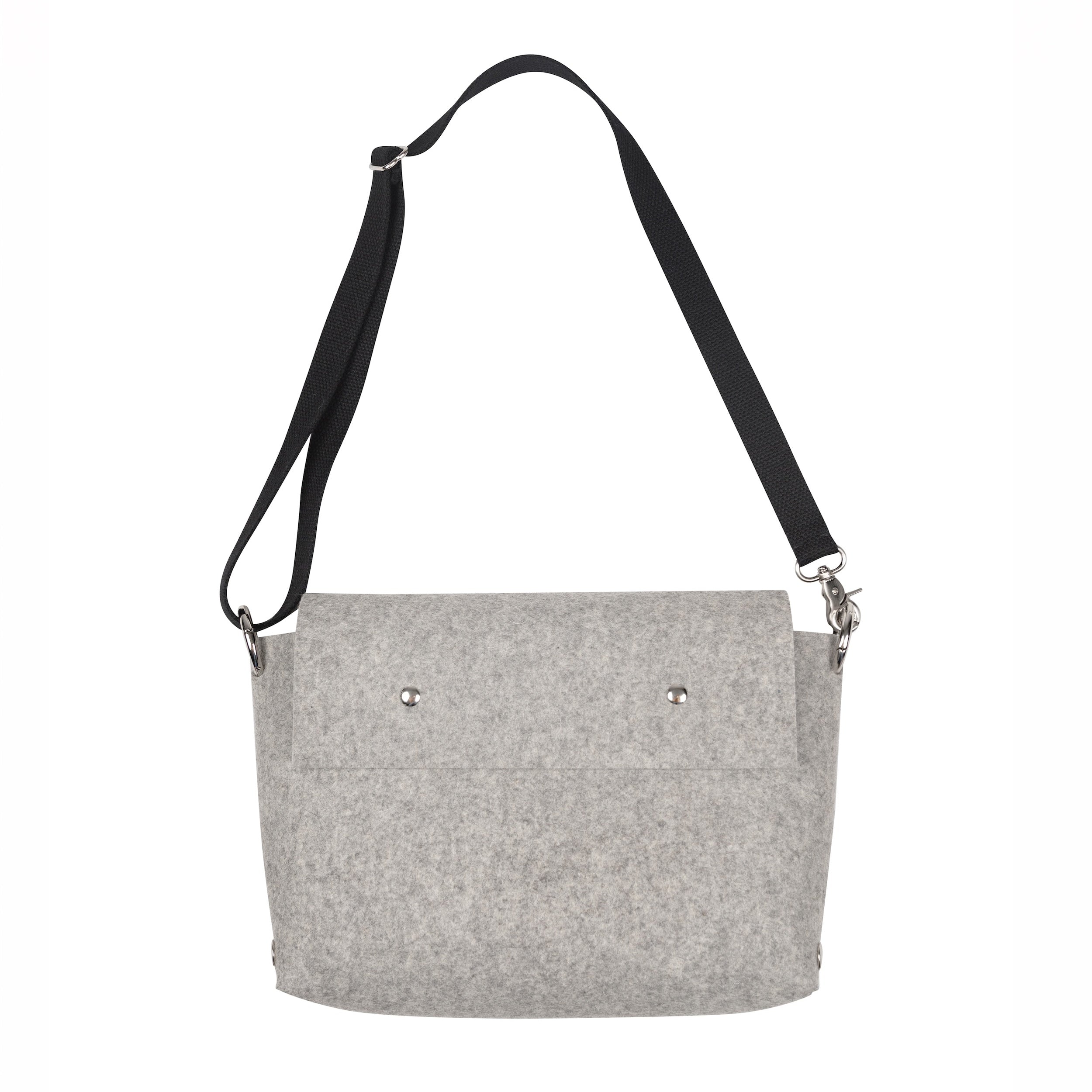 Gray shoulder bag with black strap on a white background