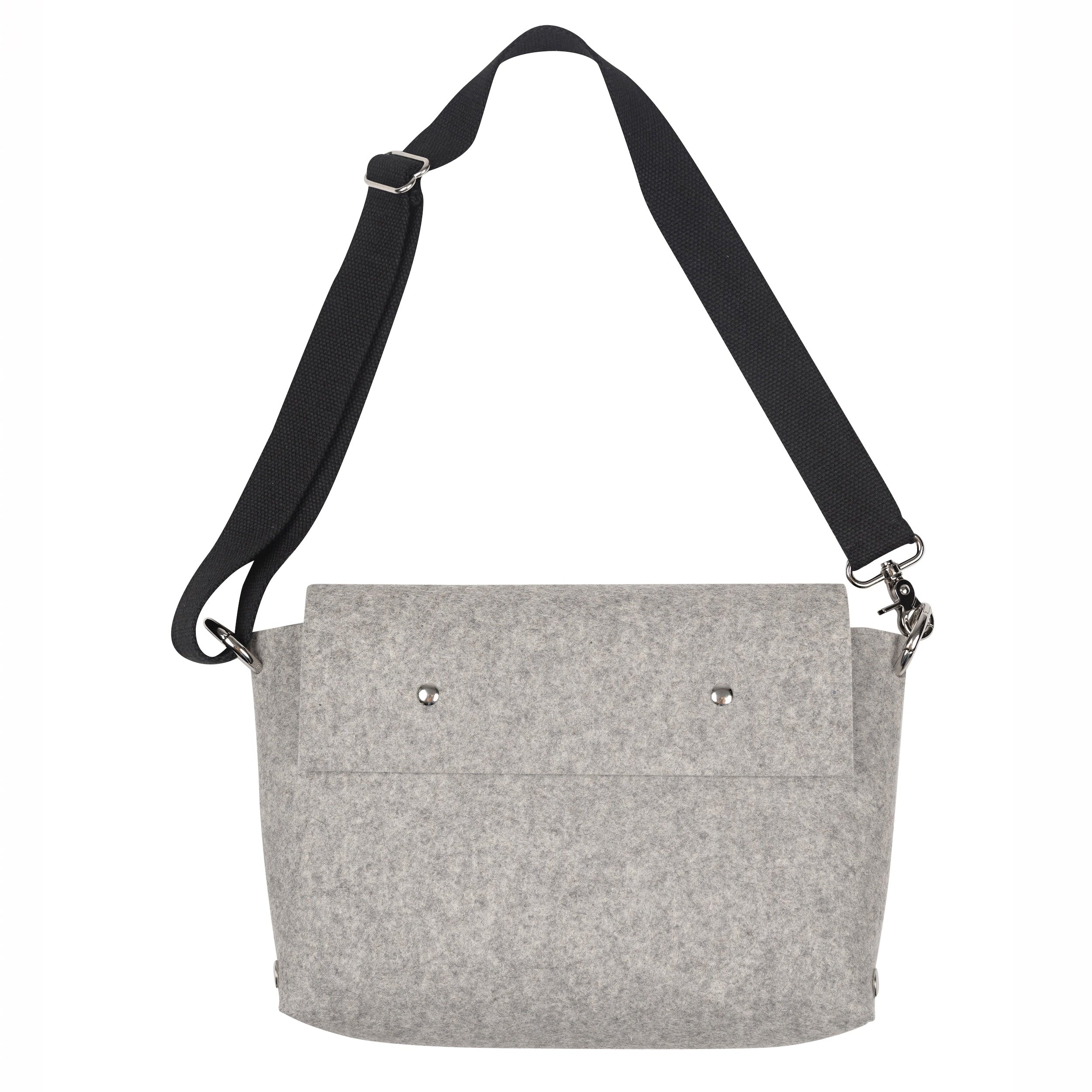 Gray bag with a black strap on a white background